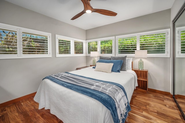 4282 Kalaheo Dr, Kalaheo, HI 96741 - bedroom featuring baseboards, wood finished floors, multiple windows, and ceiling fan
