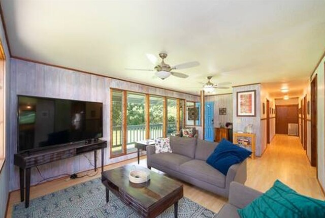 15-1893 32nd Ave, Keaau, HI 96749 - living room featuring ceiling fan, light wood-style floors, and wooden walls