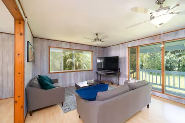 15-1893 32nd Ave, Keaau, HI 96749 - living room with a ceiling fan, light wood finished floors, and wood walls