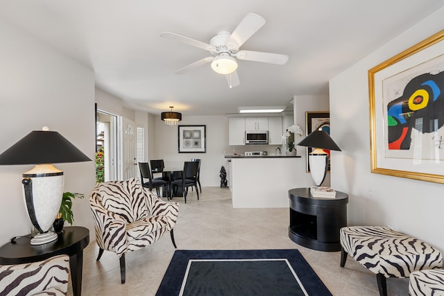 75-6081 Alii Dr Unit Ff102, Kailua-Kona, HI 96740 - living area featuring light tile patterned floors and a ceiling fan