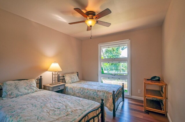 3636 Keoniana Rd, Princeville, HI 96722 - bedroom with wood finished floors, baseboards, and ceiling fan