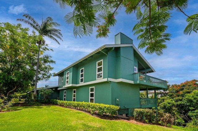 3636 Keoniana Rd, Princeville, HI 96722 - view of property exterior with a lawn and a balcony