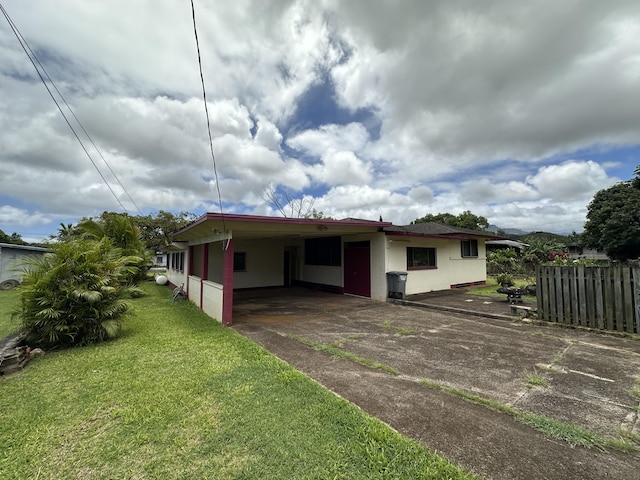 5684 Wailaau Rd, Koloa, HI 96756 - back of house with a carport and driveway