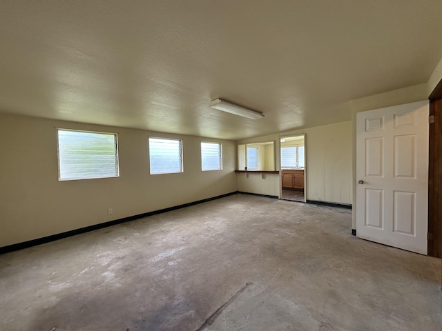 5684 Wailaau Rd, Koloa, HI 96756 - empty room with unfinished concrete flooring and baseboards