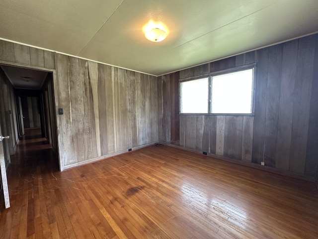 5684 Wailaau Rd, Koloa, HI 96756 - spare room featuring hardwood / wood-style floors and wood walls