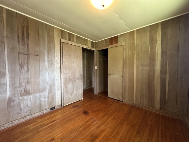 5684 Wailaau Rd, Koloa, HI 96756 - unfurnished room with wood walls and wood finished floors