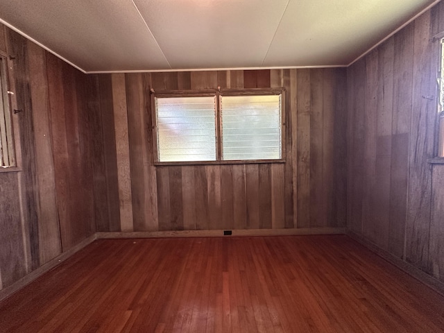 5684 Wailaau Rd, Koloa, HI 96756 - unfurnished room featuring hardwood / wood-style flooring and wooden walls