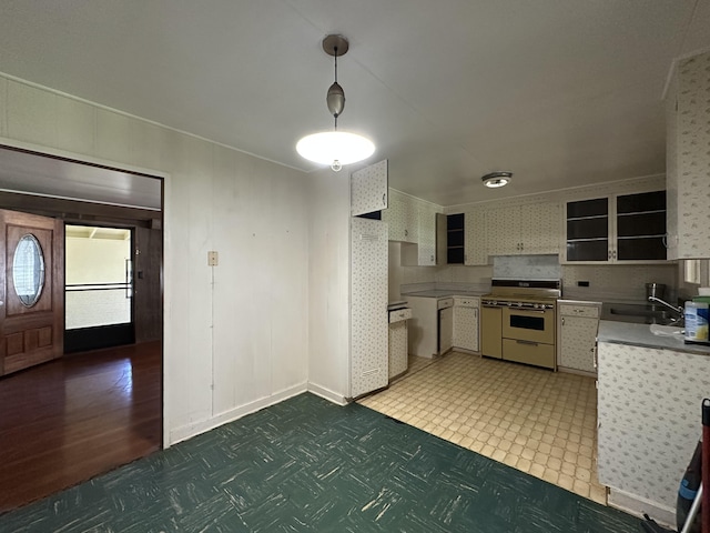 5684 Wailaau Rd, Koloa, HI 96756 - kitchen with range with two ovens, light floors, pendant lighting, open shelves, and white cabinets