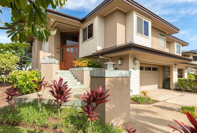 68-1025 Kaniku Dr Unit 612, Kamuela, HI 96743 - view of property featuring a garage and concrete driveway