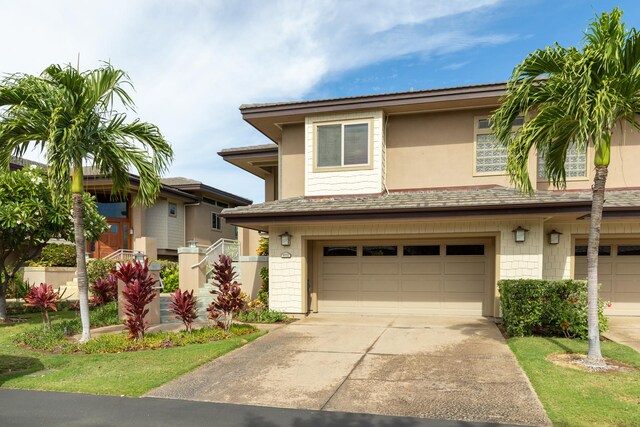 68-1025 Kaniku Dr Unit 612, Kamuela, HI 96743 - view of front of house featuring a garage, concrete driveway, and roof with shingles