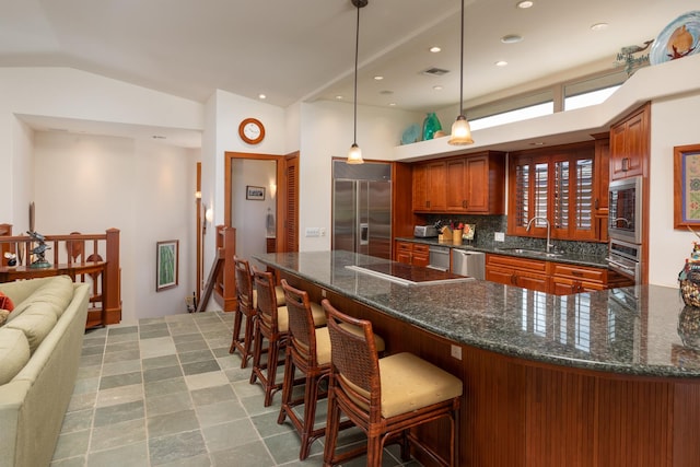 68-1025 Kaniku Dr Unit 612, Kamuela, HI 96743 - kitchen with built in appliances, a sink, decorative backsplash, a peninsula, and decorative light fixtures