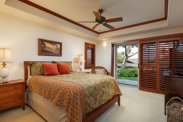 68-1025 Kaniku Dr Unit 612, Kamuela, HI 96743 - bedroom featuring access to exterior, carpet, a tray ceiling, ornamental molding, and a ceiling fan