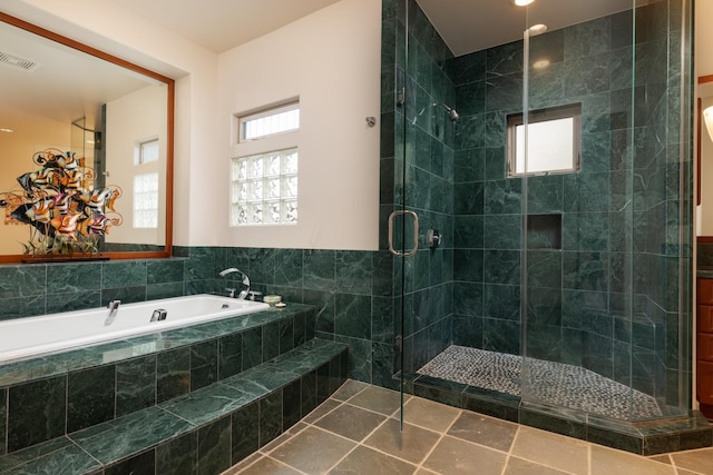 68-1025 Kaniku Dr Unit 612, Kamuela, HI 96743 - bathroom with a shower stall, a bath, and tile patterned flooring