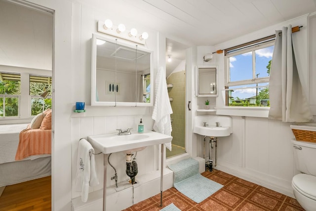 2819 Kapena St, Lihue, HI 96766 - full bath featuring plenty of natural light, toilet, tiled shower, and connected bathroom