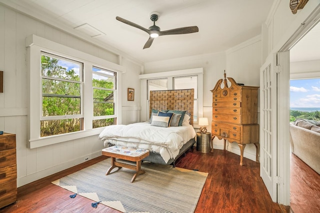 2819 Kapena St, Lihue, HI 96766 - bedroom with multiple windows, wood finished floors, crown molding, ceiling fan, and access to outside