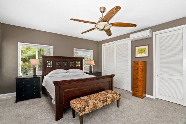 4355 Liliuokalani Pl, Kilauea, HI 96754 - bedroom with a wall mounted air conditioner, two closets, light carpet, baseboards, and a ceiling fan