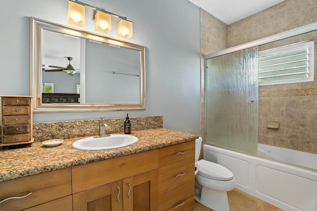 4355 Liliuokalani Pl, Kilauea, HI 96754 - bathroom featuring vanity, toilet, ceiling fan, enclosed tub / shower combo, and tile patterned flooring
