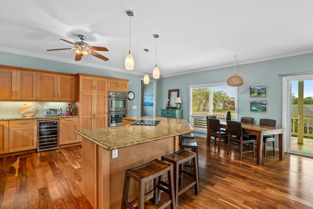 4355 Liliuokalani Pl, Kilauea, HI 96754 - kitchen featuring wine cooler, double oven, dark wood-type flooring, plenty of natural light, and crown molding