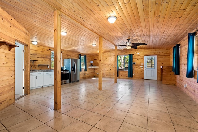 92-8856 Orchid Pkwy, Ocean View, HI 96737 - unfurnished living room featuring wood walls, a ceiling fan, a sink, light tile patterned floors, and wood ceiling