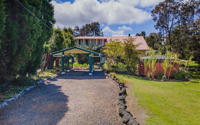 99-1798 Painiu Loop, Volcano, HI 96785 - view of green lawn featuring a detached carport