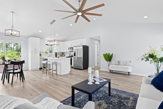 15-1754 Paradise Dr, Keaau, HI 96749 - living area with a ceiling fan, light wood-style floors, baseboards, a chandelier, and recessed lighting
