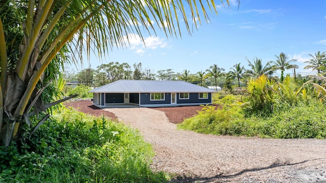 15-1754 Paradise Dr, Keaau, HI 96749 - single story home featuring dirt driveway and metal roof