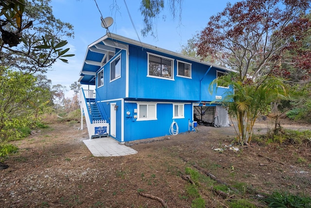 92-8821 Orchid Pkwy, Ocean View, HI 96737 - back of house featuring stairway