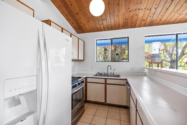 92-8821 Orchid Pkwy, Ocean View, HI 96737 - kitchen with stainless steel appliances, a sink, light countertops, lofted ceiling, and light tile patterned floors