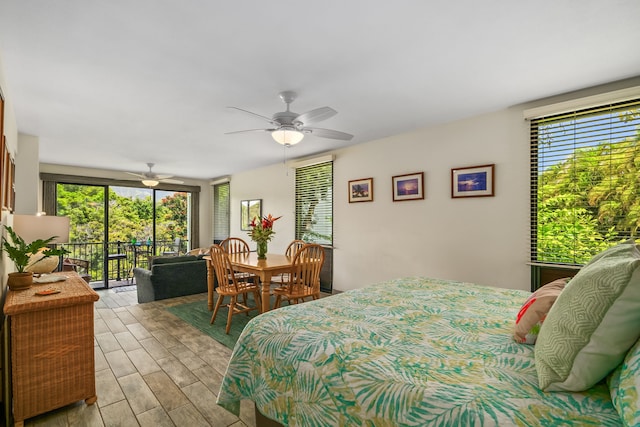 5301 Ka Haku Rd Unit 112, Princeville, HI 96722 - bedroom featuring access to outside, multiple windows, wood finished floors, and a ceiling fan