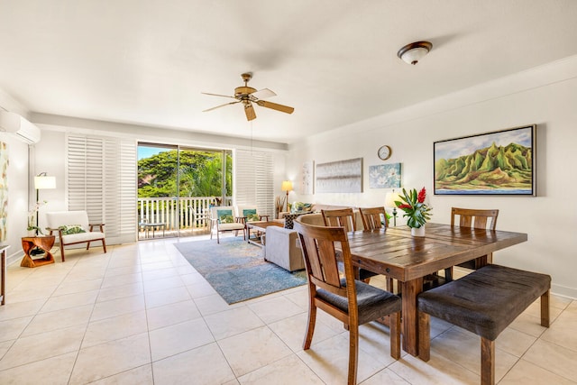 2253 Poipu Rd Unit 241, Koloa, HI 96756 - dining room featuring a wall unit AC, a ceiling fan, light tile patterned floors, and baseboards