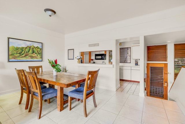 2253 Poipu Rd Unit 241, Koloa, HI 96756 - dining room featuring light tile patterned floors, baseboards, and wine cooler