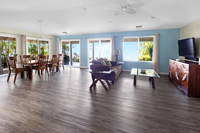 77-6596 Walua Rd, Kailua-Kona, HI 96740 - living area with healthy amount of natural light, a ceiling fan, dark wood finished floors, and baseboards