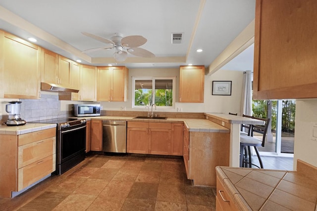 77-6596 Walua Rd, Kailua-Kona, HI 96740 - kitchen featuring stainless steel appliances, tile countertops, under cabinet range hood, light brown cabinets, and a peninsula