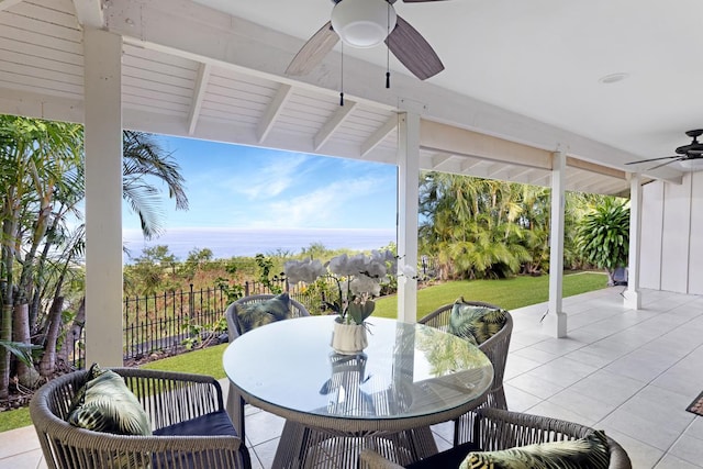 77-6596 Walua Rd, Kailua-Kona, HI 96740 - view of patio featuring ceiling fan, outdoor dining space, and a water view