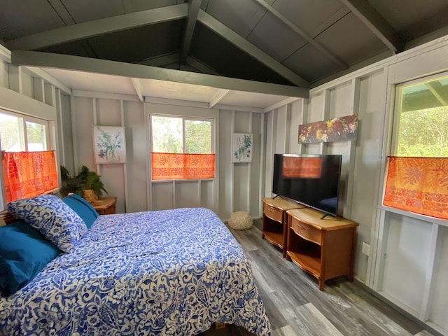 11-3141 Ala Kapena, Volcano, HI 96785 - bedroom featuring wood finished floors and a decorative wall