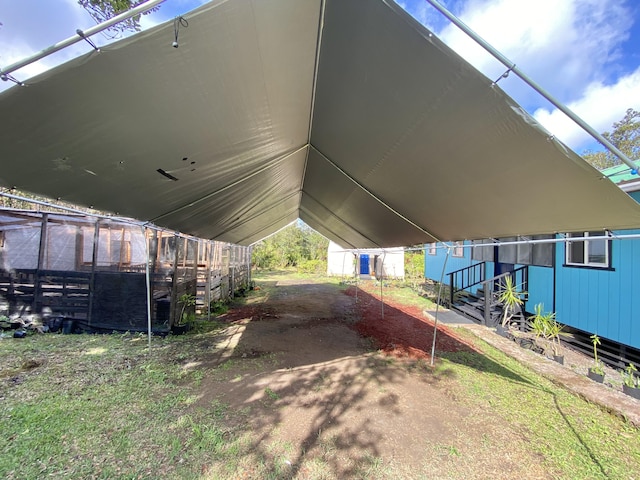 11-3141 Ala Kapena, Volcano, HI 96785 - view of side of property featuring a carport and an outdoor structure