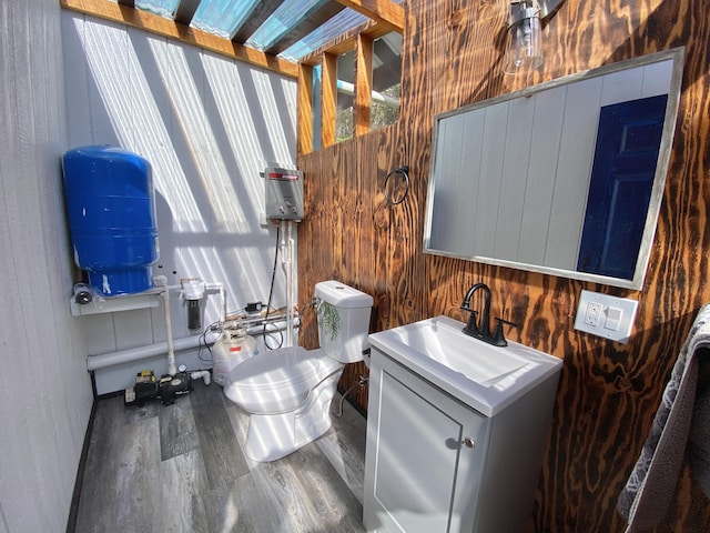 11-3141 Ala Kapena, Volcano, HI 96785 - bathroom featuring wood finished floors, vanity, toilet, and wooden walls