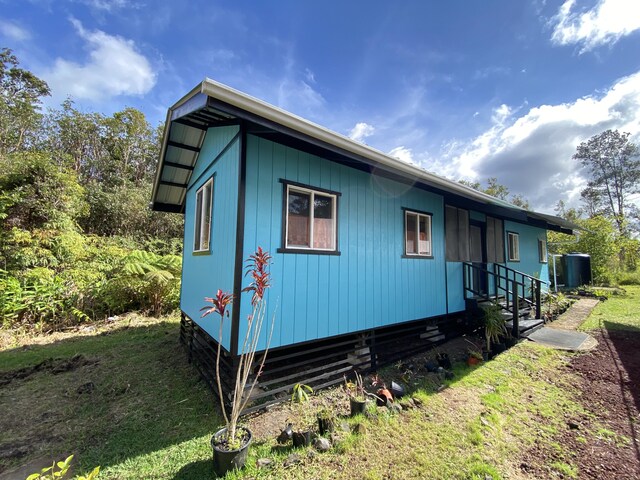 11-3141 Ala Kapena, Volcano, HI 96785 - view of side of home with a yard