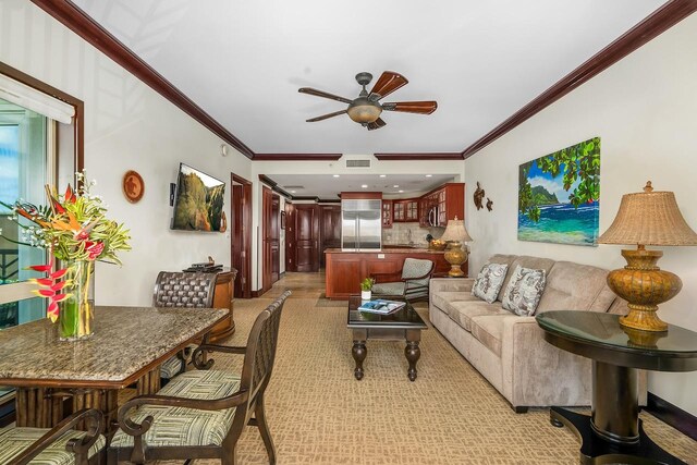 4-820 Kuhio Hwy Unit C306, Kapaa, HI 96746 - living room featuring ceiling fan, crown molding, and light carpet