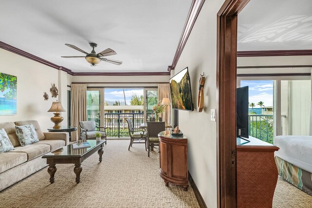 4-820 Kuhio Hwy Unit C306, Kapaa, HI 96746 - carpeted living area featuring crown molding, ceiling fan, and baseboards