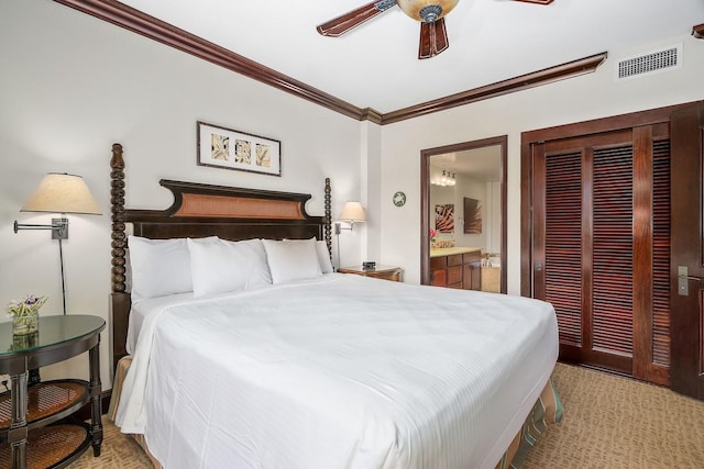 4-820 Kuhio Hwy Unit C306, Kapaa, HI 96746 - bedroom featuring crown molding, ensuite bathroom, a ceiling fan, and a closet
