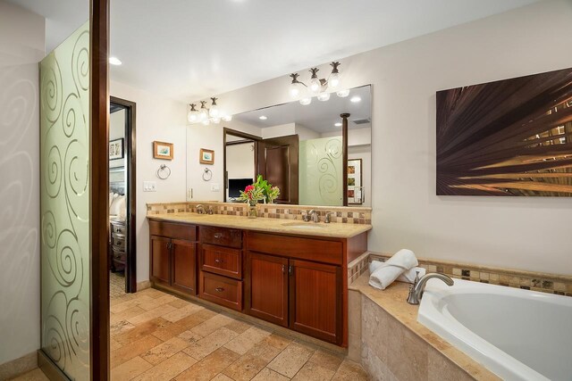 4-820 Kuhio Hwy Unit C306, Kapaa, HI 96746 - bathroom featuring double vanity, a relaxing tiled tub, tasteful backsplash, and recessed lighting