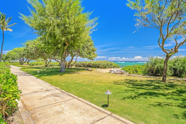 4-820 Kuhio Hwy Unit C306, Kapaa, HI 96746 - view of property's community with a water view and a lawn