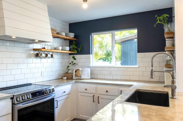 189 Poouli St, Wailuku, HI 96793 - kitchen featuring stainless steel electric range oven, custom exhaust hood, a sink, light stone countertops, and decorative backsplash