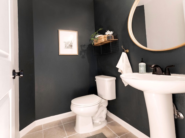 189 Poouli St, Wailuku, HI 96793 - half bath featuring tile patterned flooring, toilet, baseboards, and a sink