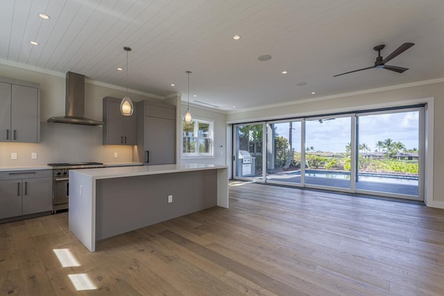 73-4804 Hinahina Rd Unit 13, Kailua-Kona, HI 96740 - kitchen featuring wall chimney exhaust hood, gray cabinets, stainless steel stove, crown molding, and light countertops