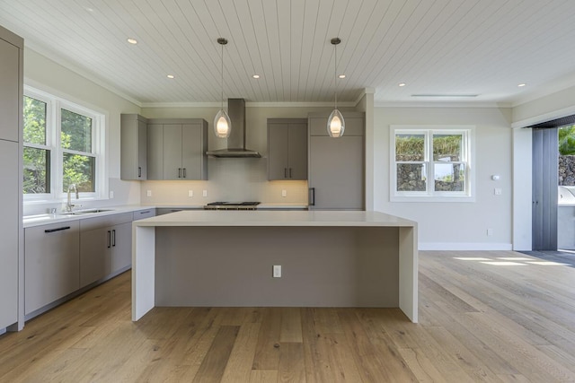 73-4804 Hinahina Rd Unit 13, Kailua-Kona, HI 96740 - kitchen with wall chimney exhaust hood, gray cabinets, a sink, a kitchen island, and light countertops