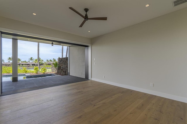 73-4804 Hinahina Rd Unit 13, Kailua-Kona, HI 96740 - unfurnished room with a ceiling fan, wood-type flooring, baseboards, and recessed lighting