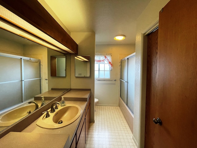 272 Lama St, Hilo, HI 96720 - full bath with toilet, tile patterned floors, vanity, baseboards, and bath / shower combo with glass door
