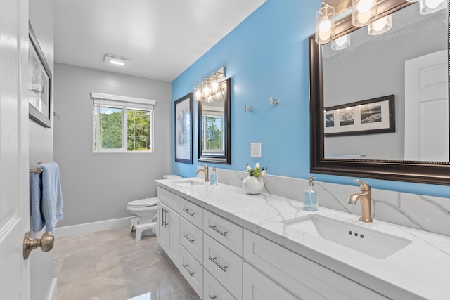 15-1884 14th Ave, Keaau, HI 96749 - bathroom featuring double vanity, toilet, baseboards, and marble finish flooring
